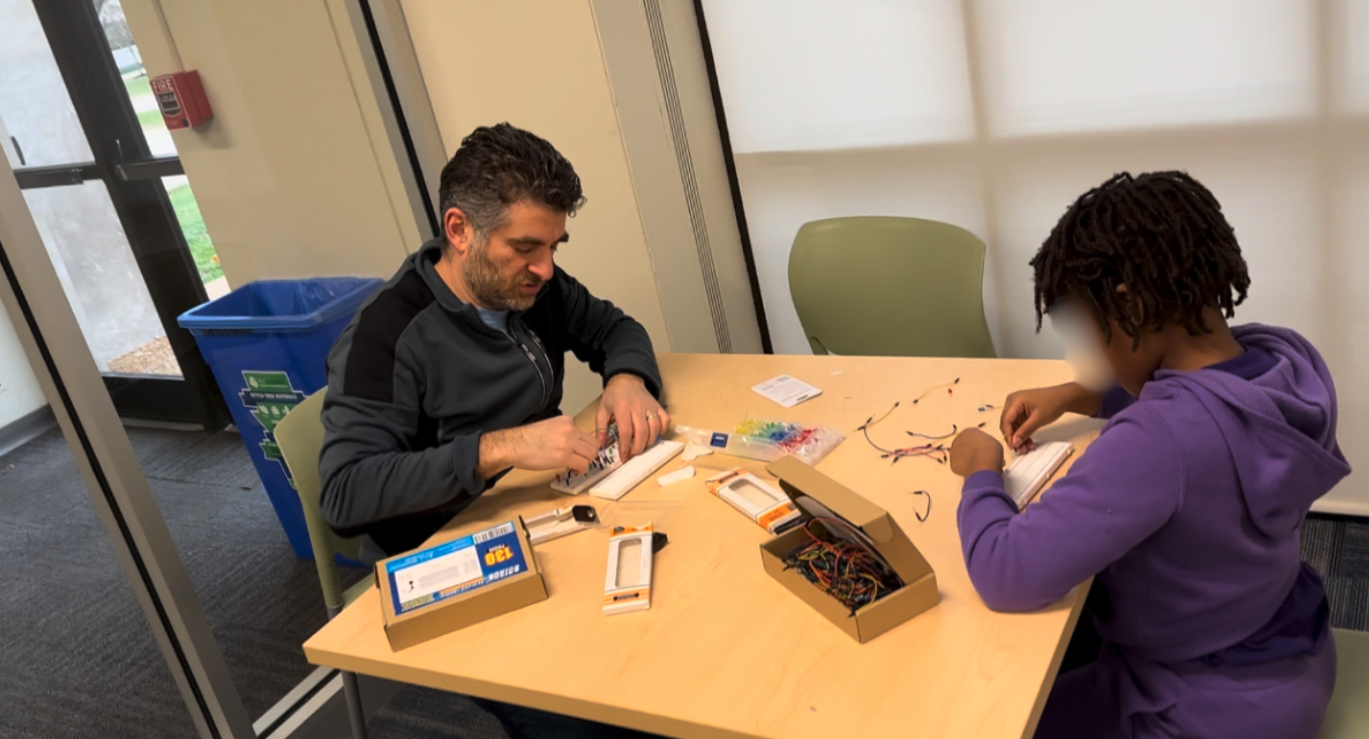 Kids being assemble a circuit